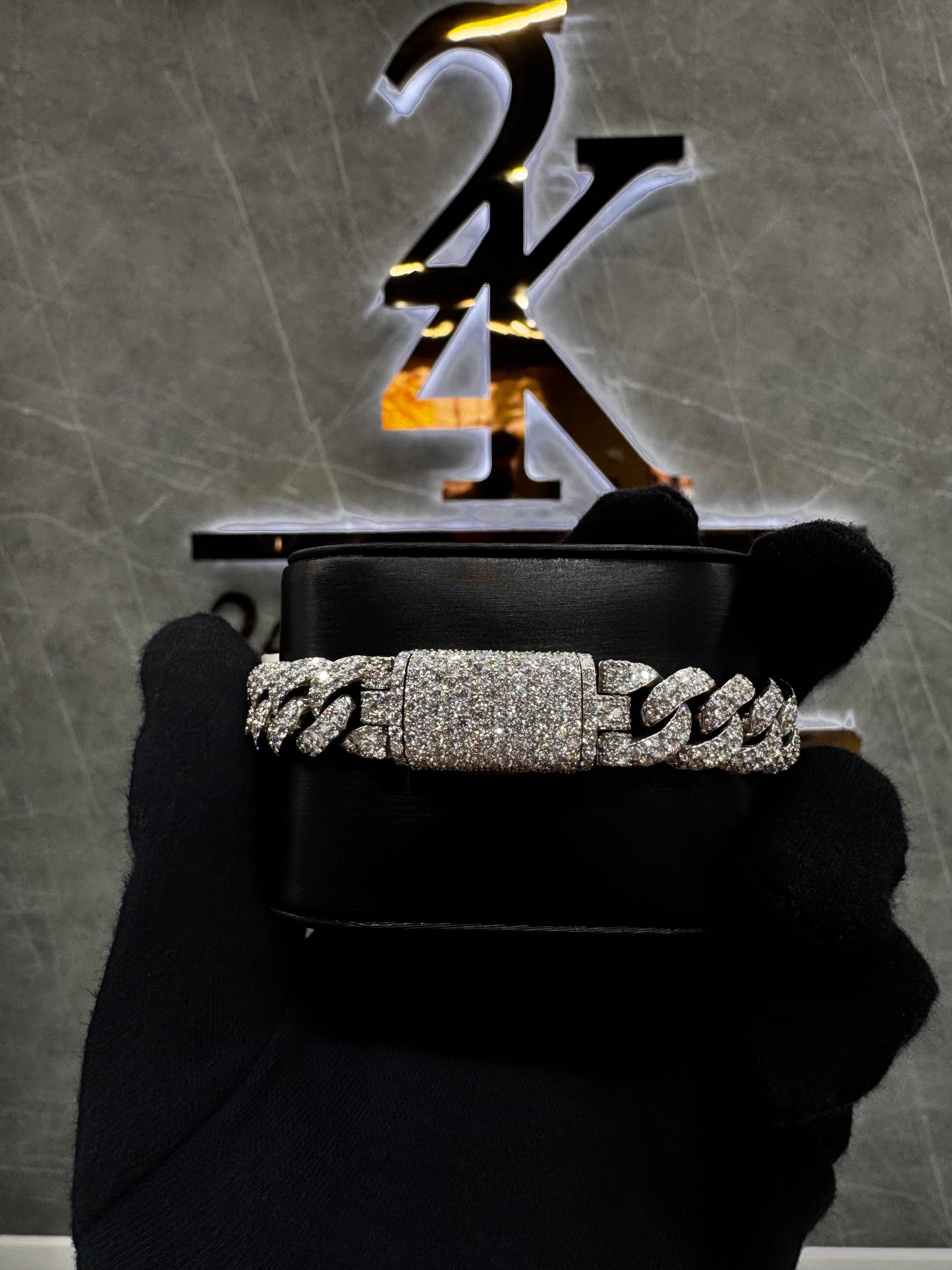 Diamond Miami Cuban link bracelet displayed on a black velvet surface, showcasing its intricate design and high-quality craftsmanship.