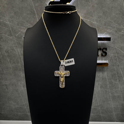  “Invisible set diamond cross pendant with seamless round-cut stones in a polished 14K gold setting.”