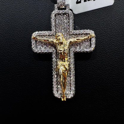 “Close-up of invisible set diamond cross pendant highlighting seamless placement of round diamonds in a sleek gold frame.”