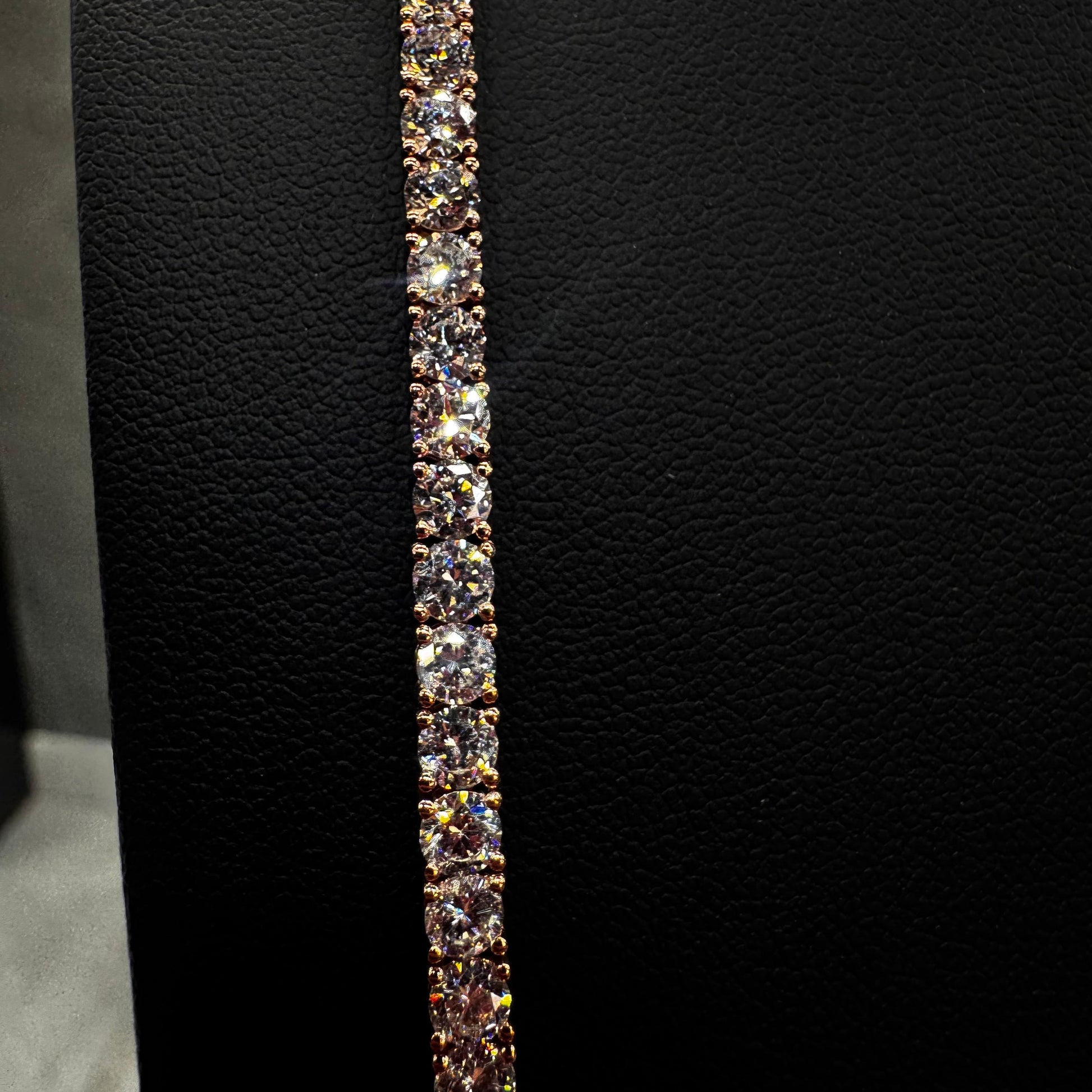 “Close-up of 20 pointer diamond tennis chain showcasing round brilliant-cut diamonds in a prong setting, set in 14K gold for a luxurious, detailed finish.”