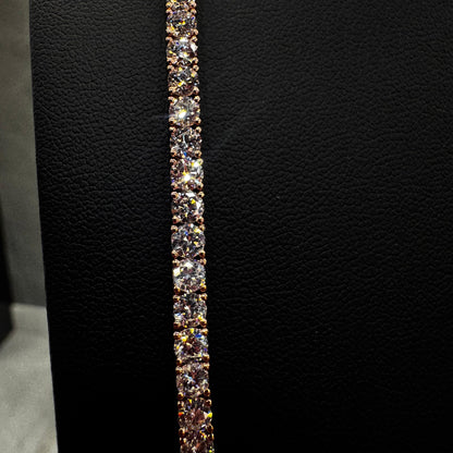 “Close-up of 20 pointer diamond tennis chain showcasing round brilliant-cut diamonds in a prong setting, set in 14K gold for a luxurious, detailed finish.”