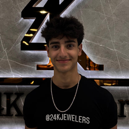“Male model wearing a 20 pointer diamond tennis chain in 14K gold, showcasing round brilliant-cut diamonds with a bold, luxurious shine around the neck.”