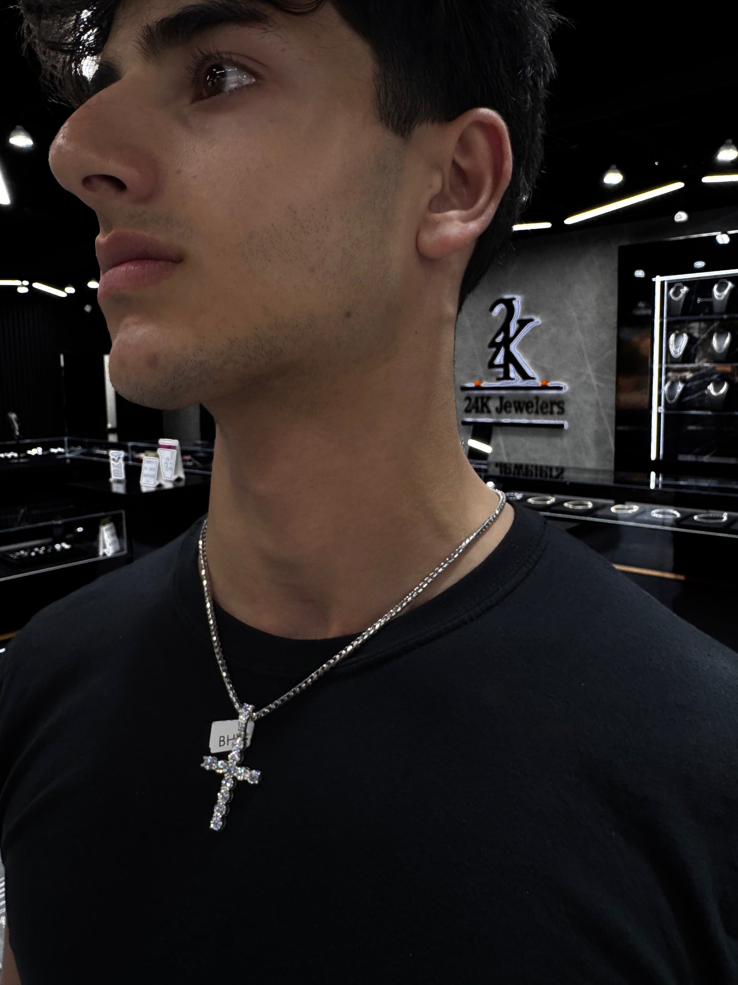 Male model wearing solid gold 40 pointer lab diamond cross pendant styled for a bold, luxurious look