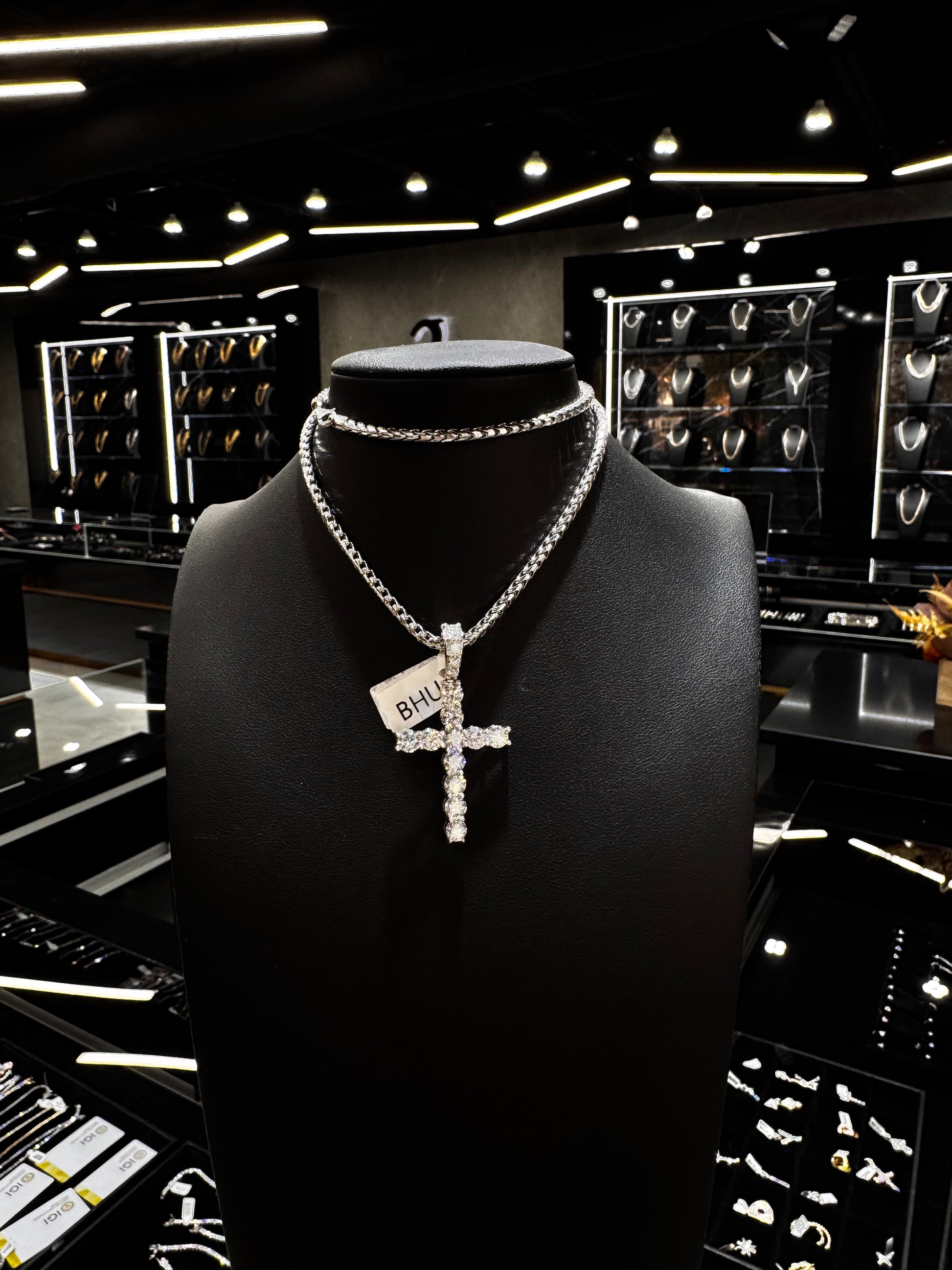 Solid gold 40 pointer lab diamond cross pendant with radiant shine displayed on a clean background