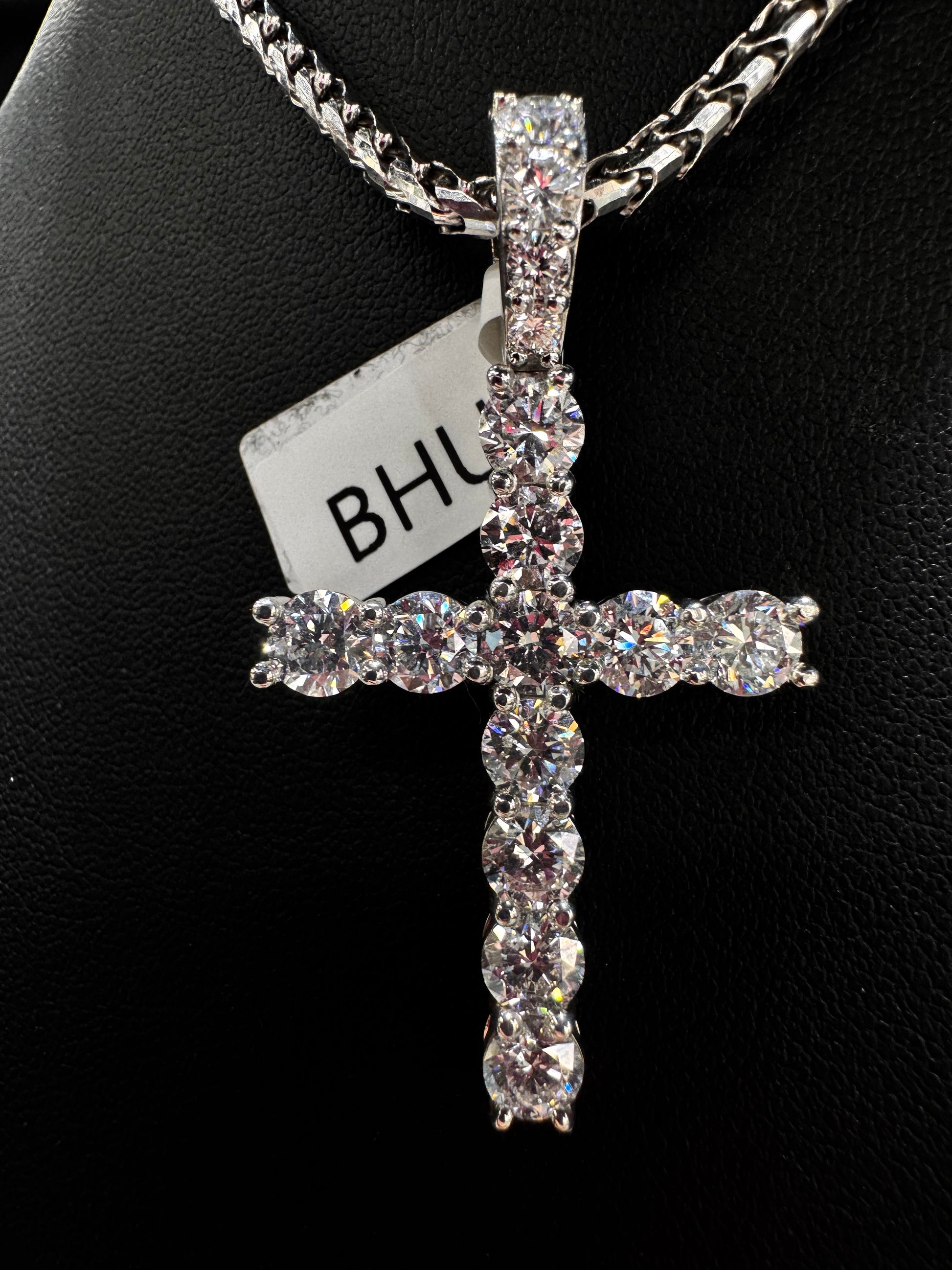 Close-up of solid gold 40 pointer lab diamond cross pendant showcasing detailed craftsmanship and sparkling lab diamonds.