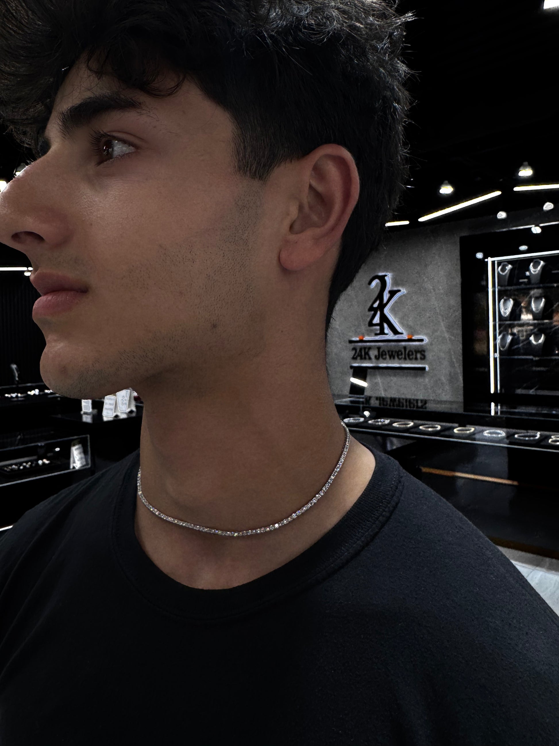 Male model wearing .925 silver 5 pointer lab diamond tennis chain styled for a sleek, luxurious look