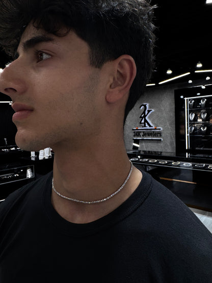 Male model wearing .925 silver 5 pointer lab diamond tennis chain styled for a sleek, luxurious look