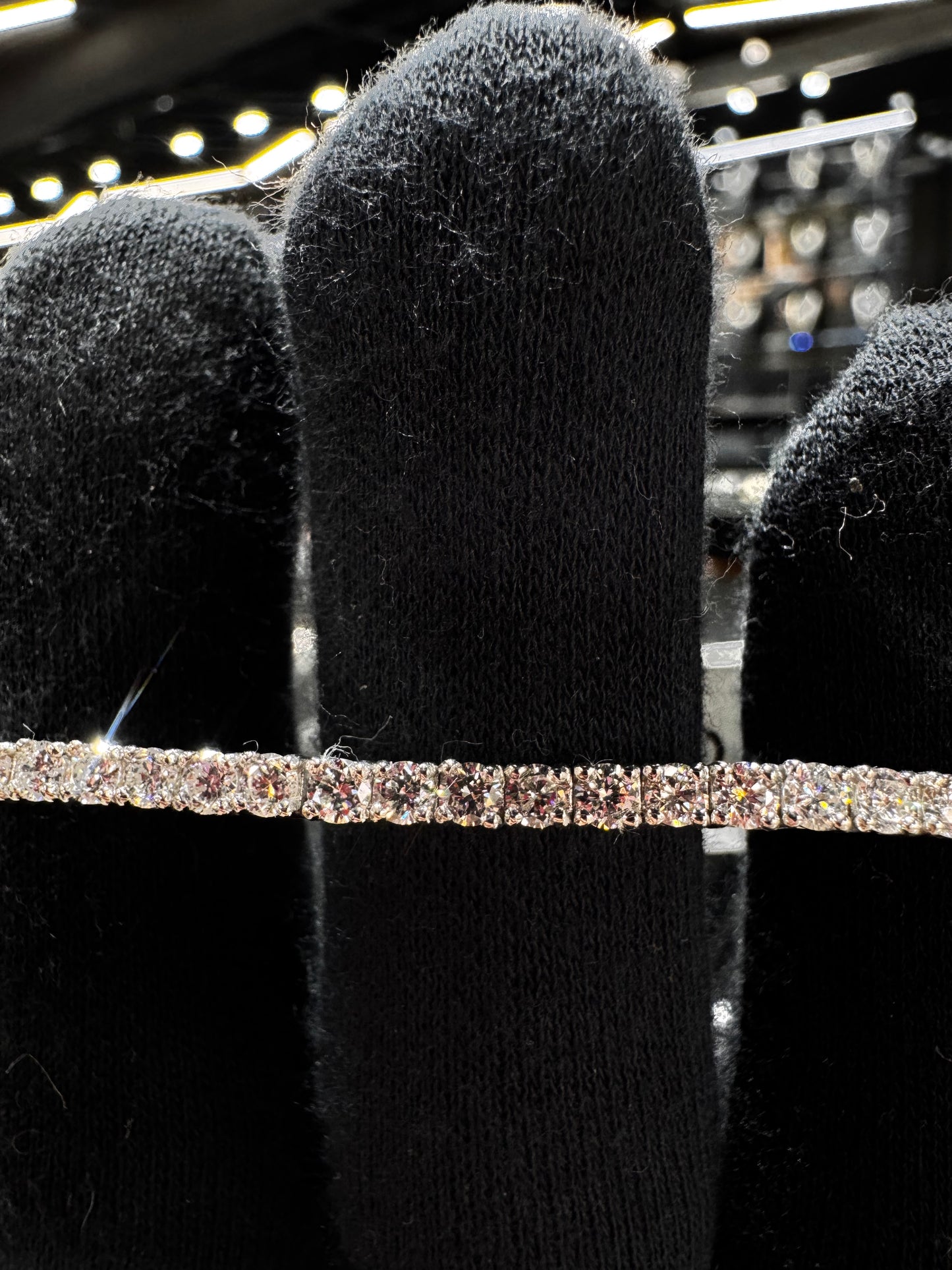 Close-up of .925 silver 7 pointer lab diamond tennis bracelet highlighting the brilliance of each lab diamond and fine silver craftsmanship.