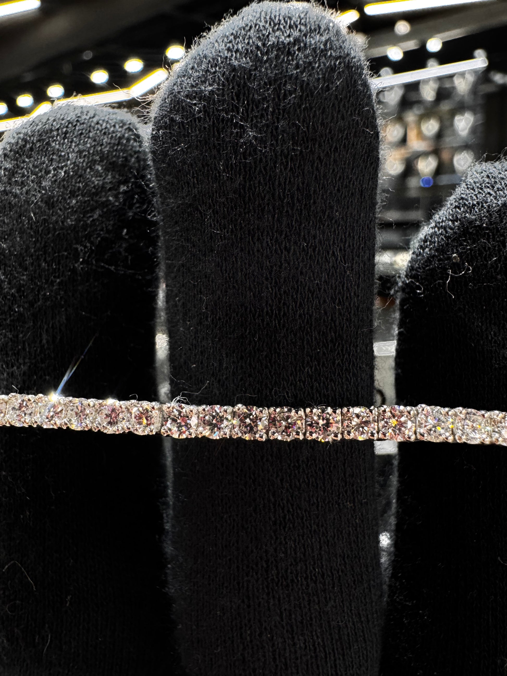 Close-up of .925 silver 7 pointer lab diamond tennis bracelet highlighting the brilliance of each lab diamond and fine silver craftsmanship.