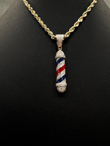 "Close-up of a white gold barber pole pendant encrusted with natural diamonds and enamel stripes, highlighting fine craftsmanship and brilliance."