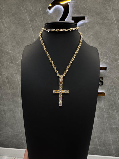 “14K gold cross pendant featuring 50-point brilliant round diamonds, set symmetrically for a clean, elegant shine. Suspended on a fine gold chain, the pendant balances luxury with timeless religious symbolism.”