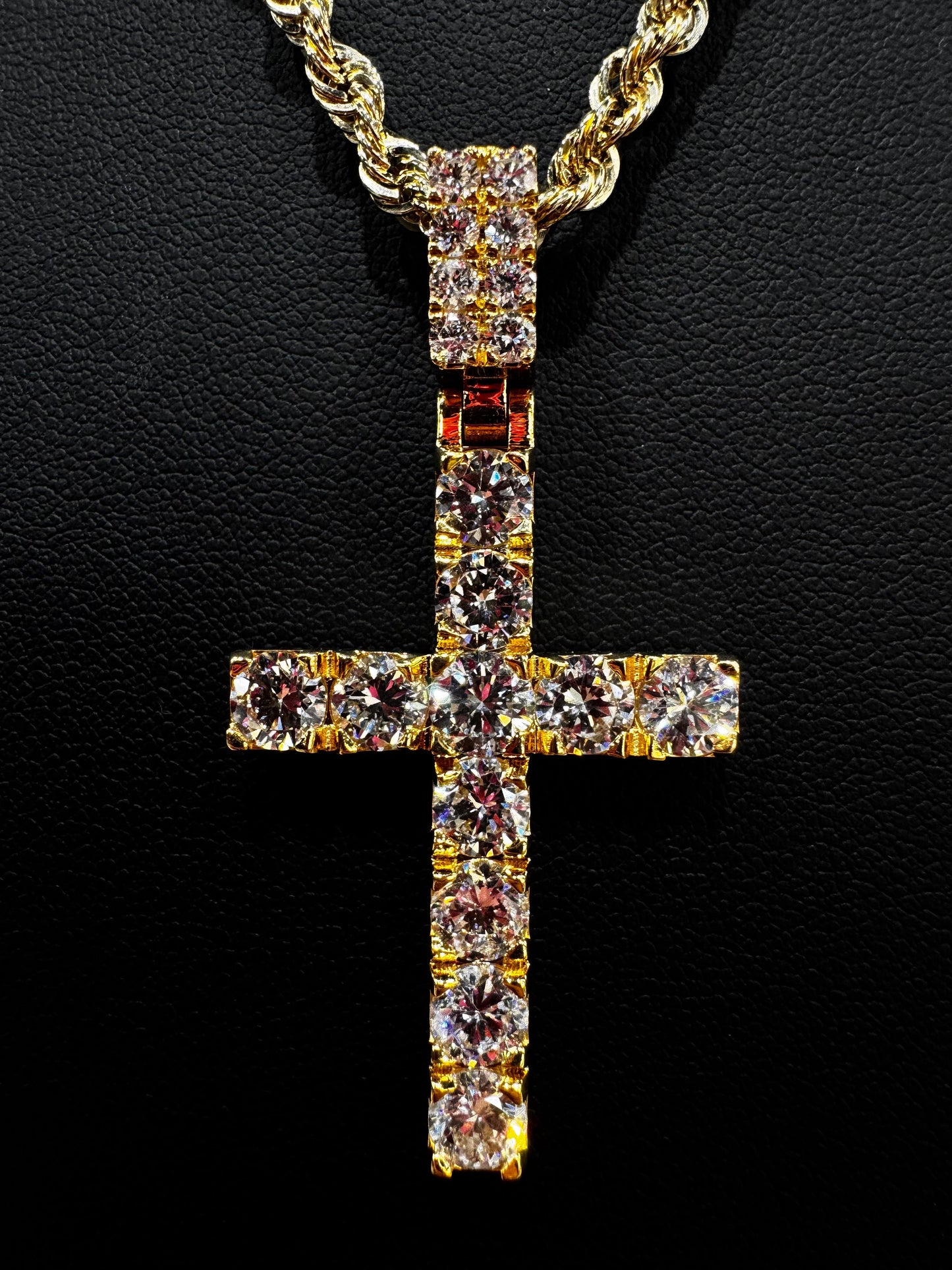 “Detailed close-up of a 14K gold cross pendant encrusted with 50-point round-cut diamonds. Each stone is prong-set with precision, showcasing exceptional clarity, sparkle, and craftsmanship.”


