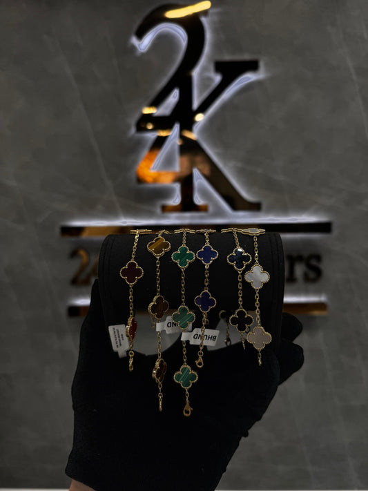 “Van Cleef & Arpels bracelet elegantly displayed against a neutral background, showcasing its luxurious clover design and fine jewelry finish.”